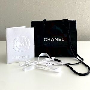 Rare glossy Chanel gift set xsmall bag, ribbon, and card